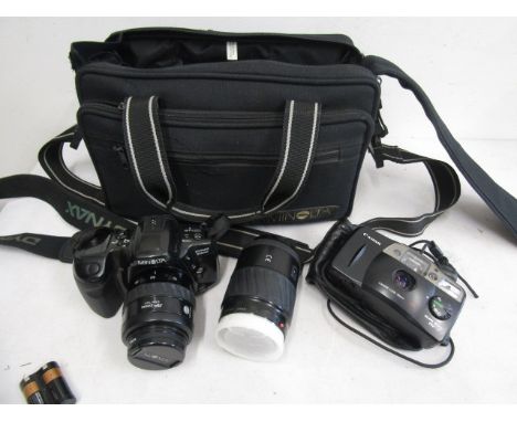 Minolta camera and lens in carry bag plus one other