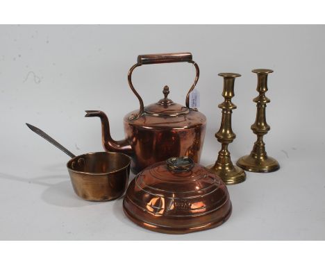 Pair of 19th Century brass candlestick, with knopped columns and circular foot, 24cm high, together with a 19th Century coppe