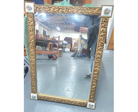 Early 20thC ornate mirror with gesso frame with each corner containing an enamelled plaque depicting a French 18thC Romantic 