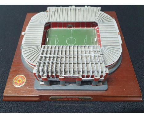 Model of Manchester United's Old Trafford ground on wood plinth,24 x 26cm x 8cm high 