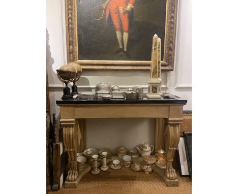 19th Century A pinewood console table with a later black stone top with feet carved into lion's paws. Property of a Lady Dime