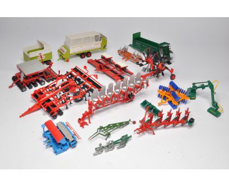 An assortment of 1/32 farm model implements comprising mostly Britains and Siku issues including Kuhn Performer, Kverneland P