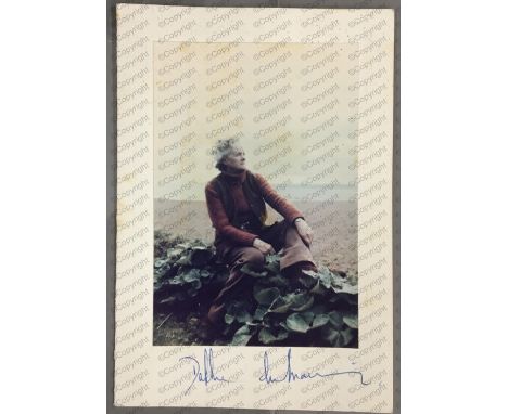 Daphne du Maurier: (1907-1989) British Author, signed colour photograph of Daphne on the beach, signed in blue ballpoint pen,