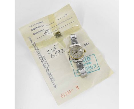 Rolex Oyster Perpetual Date stainless steel lady's bracelet watch, ref. 6517, circa 1962, serial no. 899xxx, gold bezel, silv