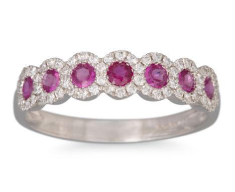 A RUBY AND DIAMOND RING, the round rubies to diamond surround, mounted in 18ct white gold, size O