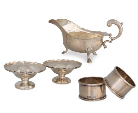 A COLLECTION OF SILVER, to include a helmet shaped sauce boat, a pair of bon bon dishes, a pair of napkin rings, (UK hallmark