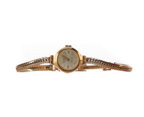 LADY'S ROTARY NINE CARAT GOLD MANUAL WIND WRIST WATCH, the round white dial with applied gold coloured baton hour markers, 15