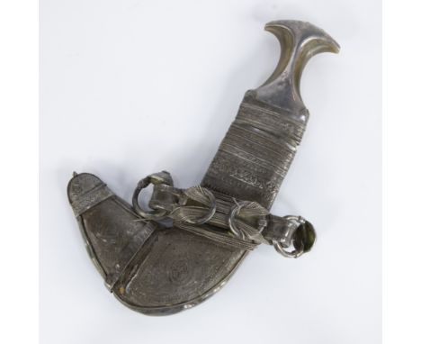 A Saidi Khanjar or Omani dagger, traditional curved dagger with a horn hilt, richly decorated scabbard with engraved metal fi