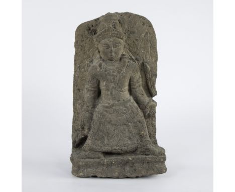Stone temple fragment depicting a standing female figure, probably an apsara, dressed in a richly decorated robe and with jew