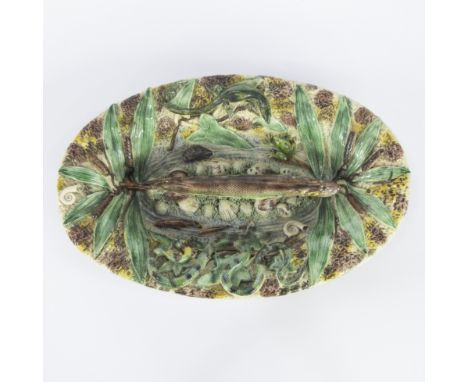 High relief majolica plate in the style of Bernard PALISSY, richly glazed and modelled with a nature scene of a fish surround