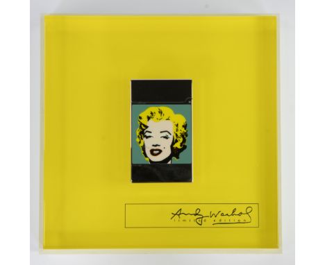 Silver-colored lighter by ST Dupont limited edition Marylin Monroe, made of polished metal with engraved text of Andy Warhol'