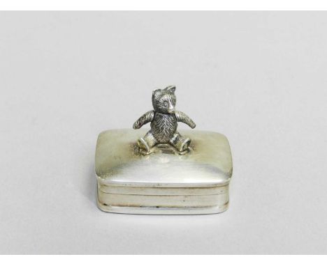 A silver pill box with teddy bear finial, ARC Gold &amp; Silver Ltd, Sheffield, the teddy bear finial with moving arms, 38mm 