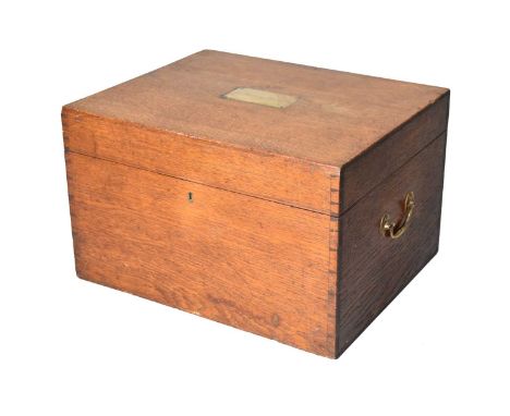 A small late Victorian oak silver chest, of rectangular outline with brass bale carry handles and a brass plaque to the top i