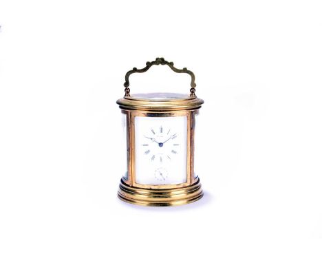 An early 20th century French, oval brass carriage clock, with a 2.75" enammelled dial, signed 'Henri Marc A Paris' and with a