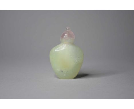 A Chinese jade snuff bottle, Qing/RepublicThe pale green stone of ovoid form and well hollowed, the stopper with rose quartz 