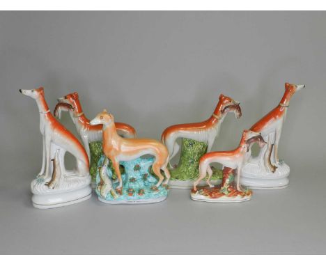 Four Staffordshire models of hare coursing greyhounds, circa 1860-80, together with a further pair of late 20th-century repro