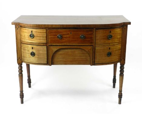 A 19th century mahogany veneered bow-fronted sideboard, inlaid with ebony stringing and dots, the cossbanded top above a frie