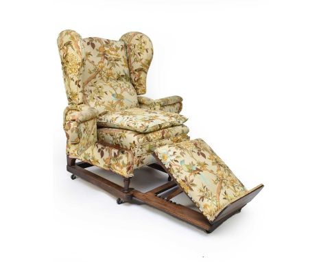 A Victorian Foot &amp; Son patent upholstered reclining reading chair, the winged back over overstuffed seat, between hinged 