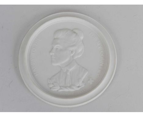 A Royal Worcester Bisque Porcelain Edith Cavell Commemorative Plaque, dated 1916, of circular form moulded with a bust portra
