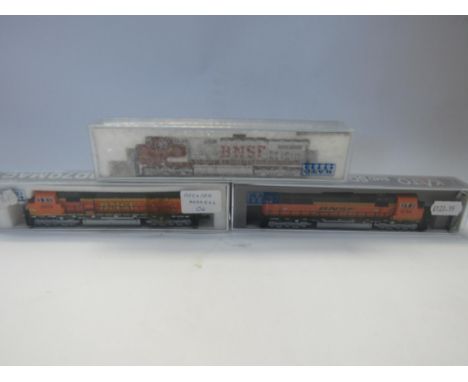 Three Perspex cased Kato N gauge model railway locomotives in BNSF livery to include 176-6321-DCC EMD SD70MAC #9748, 176-3507