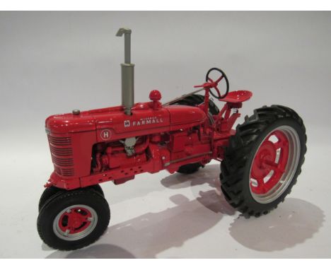 A Franklin Mint 1:12 scale diecast Farmall Model H tractor, unboxed 