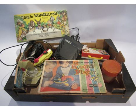 An assortment of vintage toys and games including Fisher Price radio, Spear's Alice in Wonderland game, Marx record player, A