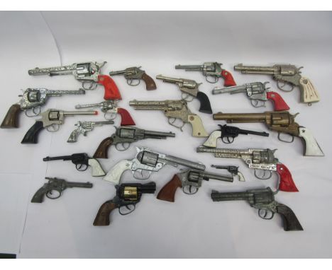 A collection of playworn toy guns, cap guns and pistols including Hubley, Lone Star, Wicke etc together with assorted holster