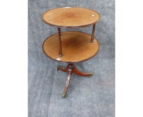 AN ANTIQUE MAHOGANY TWO TIER DUMB WAITER ON SABRE LEG TRIPOD BASE.   DIA.64cms.