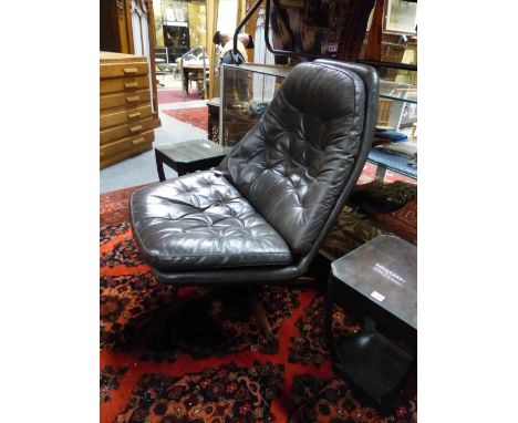 A DANISH RETRO BROWN LEATHER BUTTON BACK AND SEAT SWIVEL CHAIR WITH ROSEWOOD STAR SHAPED BASE. BY MADSEN SCHUBELL.