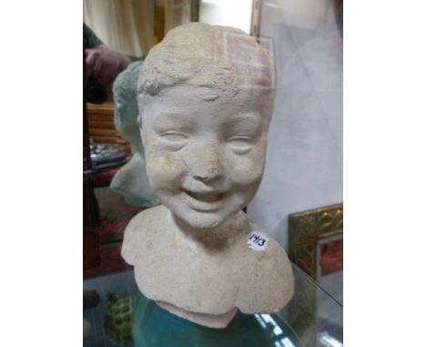 AN EARLY 20th.C. STUCCO PORTRAIT BUST OF A CHILD. H.34cms.