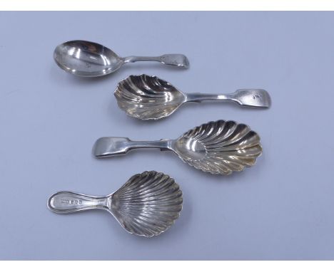 TWO SILVER HALLMARKED AND TWO WHITE METAL CADDY SPOONS OF VARIOUS STYLES AND DATES TO INCLUDE AN 1866 VICTORIA ASSAYED IN LON