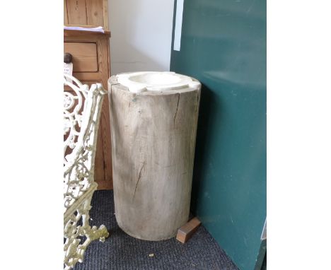AN ANTIQUE LARGE MARBLE MORTAR WITH FOUR LUGS, FITTED CIRCULAR TRUNK FORM RUSTIC BASE.   OVERALL DIA.42cms, H.69cms.