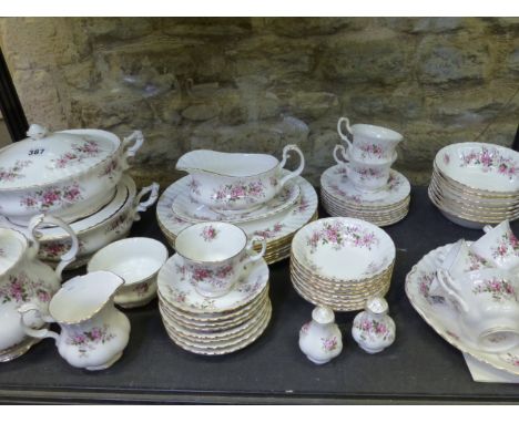 A ROYAL ALBERT BONE CHINA LAVENDER ROSE PATTERN PART DINNER AND TEA SERVICE FOR EIGHT PLACE SETTINGS.