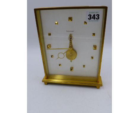 A JAEGER LE COULTRE ANODISED BRASS CASED  DESK CLOCK WITH VISIBLE SKELETON TYPE MOVEMENT,  NUMBERED 385 TO THE BASE.