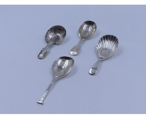 THREE SILVER HALLMARKED AND ONE WHITE METAL CADDY SPOONS OF VARIOUS STYLES AND DATES TO INCLUDE AN 1834 LONDON, AN 1865 SHEFF