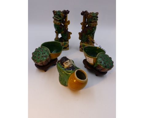 A PAIR OF CHINESE SANCAI POTTERY JOSS STICK HOLDERS IN THE FORM OF FOO DOGS   (H.15cms.), A PAIR OF LOTUS FORM DISHES AND A S