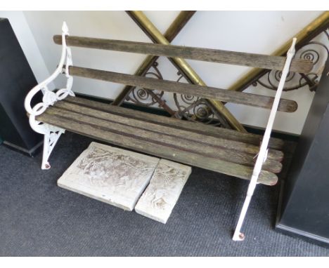 A GARDEN BENCH OF VICTORIAN DESIGN WITH WOOD SLAT BACK AND SEAT.   W.165cms.