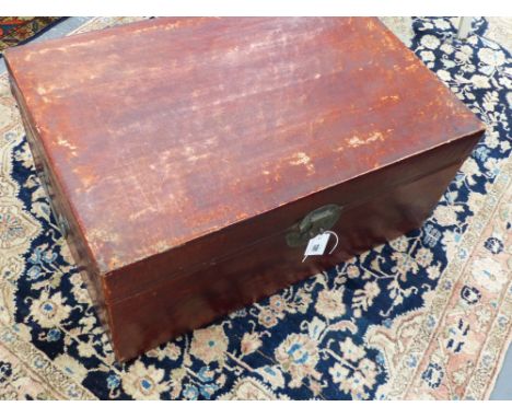 A CHINESE PARCHMENT OR VELLUM COVERED TRUNK WITH BRASS FITTINGS AND CARRYING HANDLES.      73cms WIDE x 33cms HIGH.