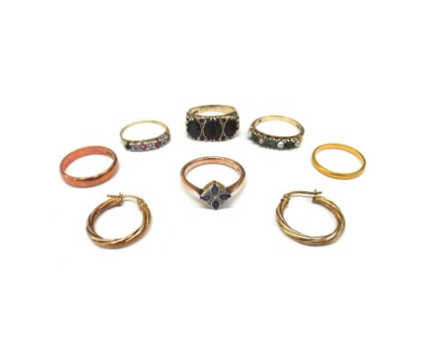 A 22ct gold wedding band 2.1g, a 9ct gold wedding band, a pair of 9ct gold earrings, a 9ct gold and garnet set ring, a caboch