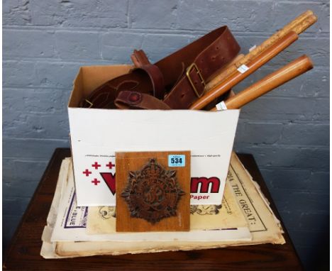 A quantity of swagger sticks, a Royal Army Service Corps George VI carved wooden crest, a collection of Illustrated London Ne