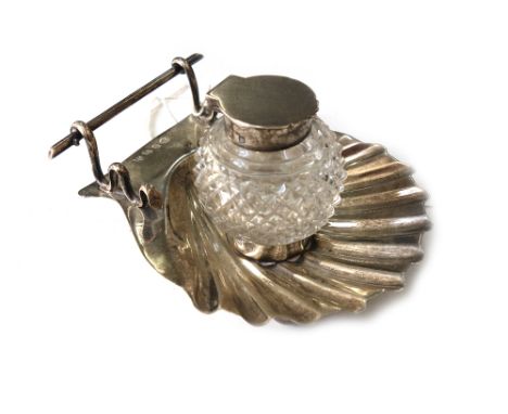 A Victorian silver and cut glass inkstand, Edward John & Noble Haseler, Birmingham 1896, the scallop shell base with a pen re