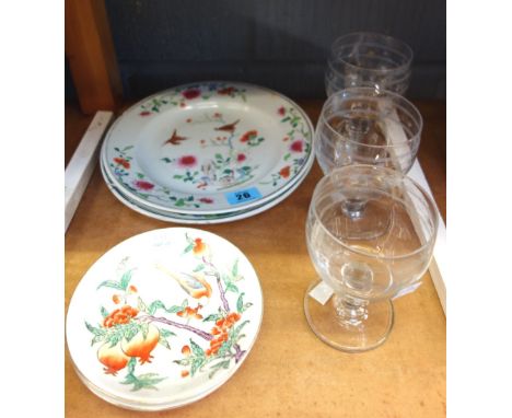 Three Chinese famille rose plates, Qianlong, painted with birds and flowers, 22.5cm high, together with a pair of saucers pai