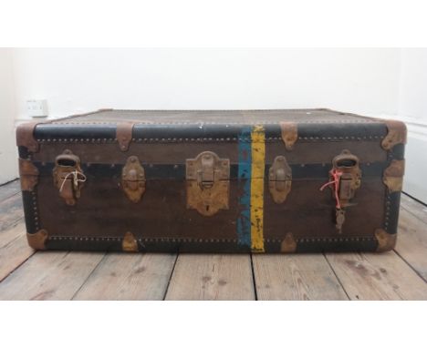 Three vintage trunks, one labelled 'Becker's Leather Goods Co., Washington DC', 87cm wide.