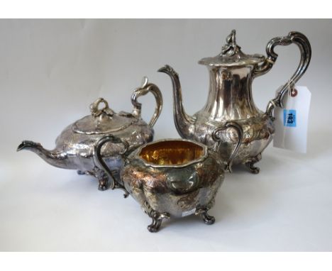 An Old Sheffield plate melon pattern three piece tea and coffee service, circa 1840, foliate and diaper chased, engraved with