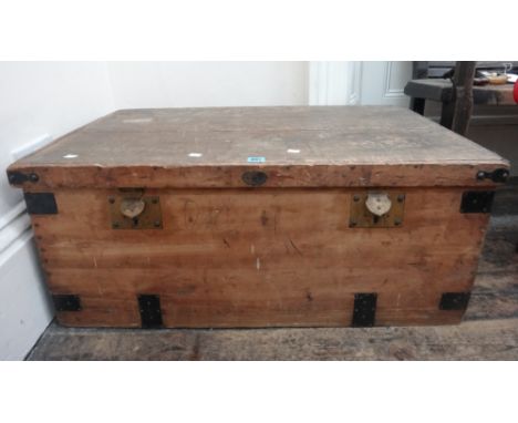 A French metal bound wooden trunk with hinged top, late 19th century, labelled 'Preiffer... Paris', 92cm wide.