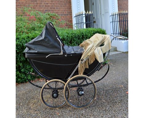A vintage Millsons Ltd. pram with black coachwork, two additional hoods and covers.  Illustrated. An almost identical pram wa