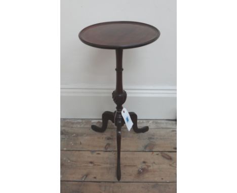 A George III style mahogany wine table, early 20th century, the dished circular top on a turned pillar and tripod base, 32cm 