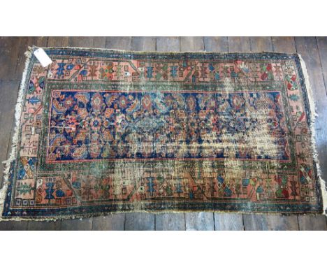 A Belouch carpet with repeated lozenges and arrow motifs, 209cm x 109cm and a Hamadan rug, (2).