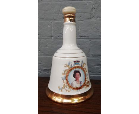 Bells Scotch Whisky; a collection of sixteen Wade commemorative porcelain decanters, five boxed, (16).