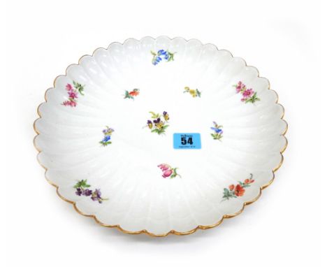 A late Meissen porcelain part tea service painted with flowers and insects including; three cups, five saucers, six tea plate